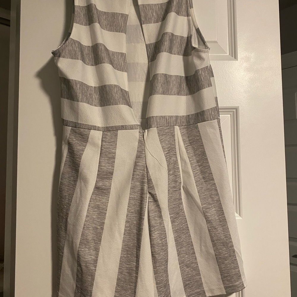 gray and white romper. small